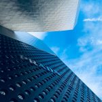 white clouds over gray building